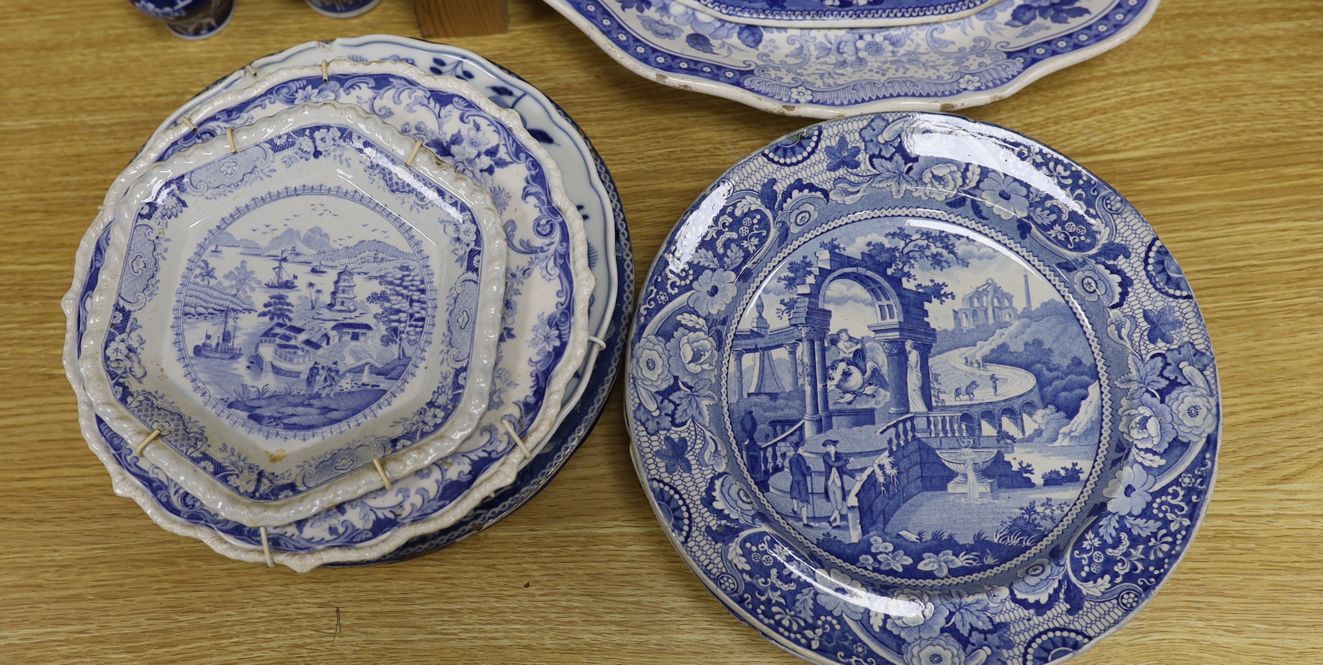 An early 19th century John Meir and Sons blue and white printed 'Fairy Villas' meat dish together with a collection of Staffordshire and other blue and white dishes and two baluster jars and covers, the largest 50cm wide